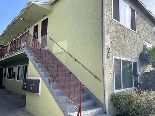 a building with a staircase on the side of it at Beautiful unit in the heart of Belmont Shores ! in Long Beach