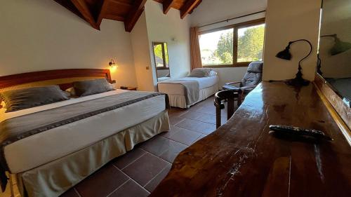 Ένα ή περισσότερα κρεβάτια σε δωμάτιο στο Hotel Pucon Green Park