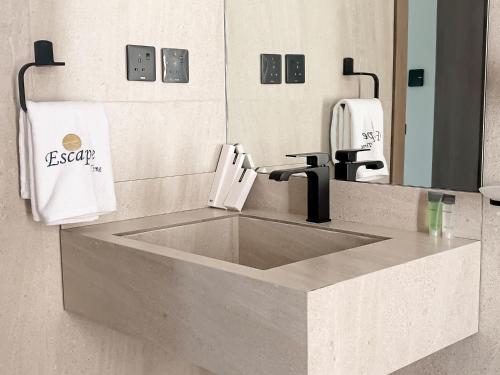 a bathroom with a sink and a mirror at Moon mountain villa 