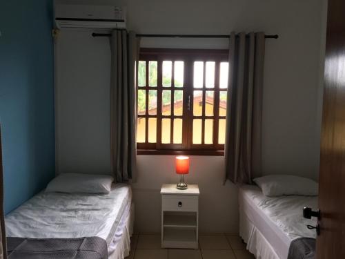 Una cama o camas en una habitación de Apartamentos Villa Porto do Sol