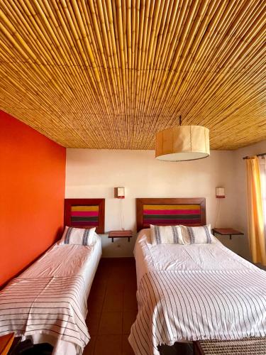 Кровать или кровати в номере Hotel Refugio Del Sol