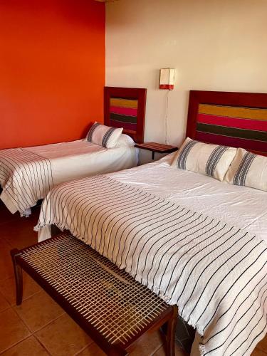 Кровать или кровати в номере Hotel Refugio Del Sol