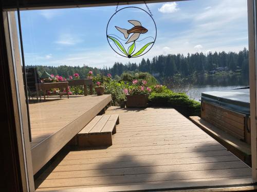 a view of a dock with a fish hanging from a window at Cottage Lake Bed and Breakfast in Woodinville