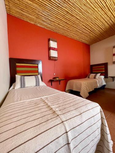 Кровать или кровати в номере Hotel Refugio Del Sol