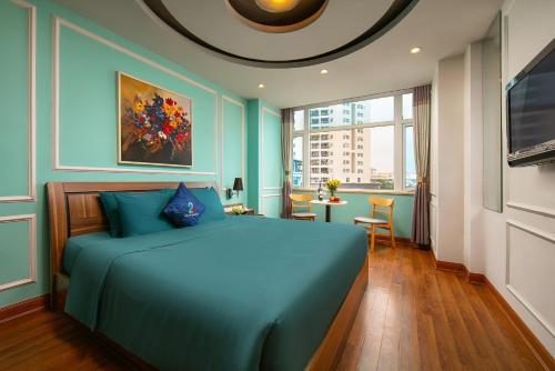 a bedroom with blue walls and a bed in a room at Hai Mươi Hotel & Apartment in Hanoi