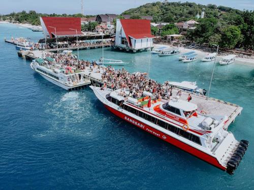 a group of people on a boat in the water at Gili Ferries Ganggari Speedboat in Padangbai