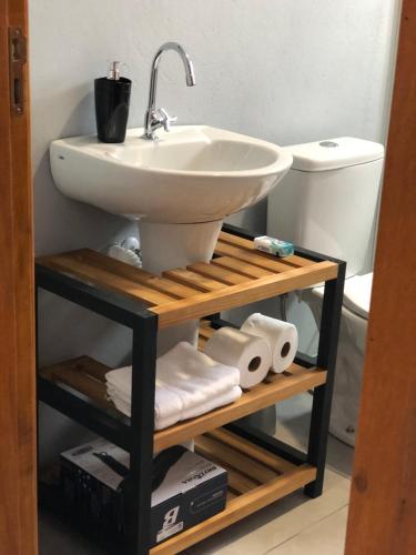 a bathroom with a sink and a toilet at Morada Pomerode in Pomerode