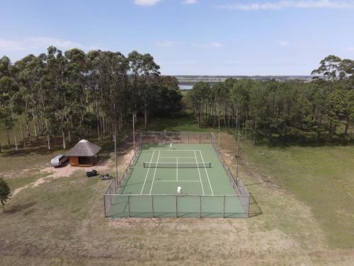 an overhead view of a tennis court in a field at Estancia Santa Cruz in José Ignacio