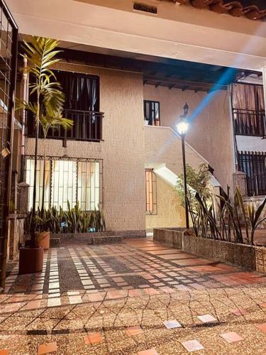 a courtyard of a building with a street light at Casa de Descanso en Medellín in Medellín