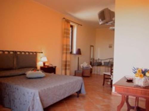 Postel nebo postele na pokoji v ubytování Residence Hotel La Commenda