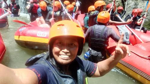 a woman in a raft in the water at Hause market in Sidemen