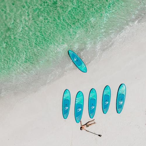 a group of people on a beach with surfboards at Cervantes Lodge in Cervantes