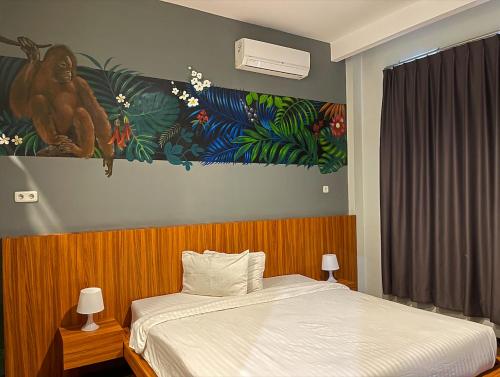 Lova arba lovos apgyvendinimo įstaigoje Ladja Hotel Sintang