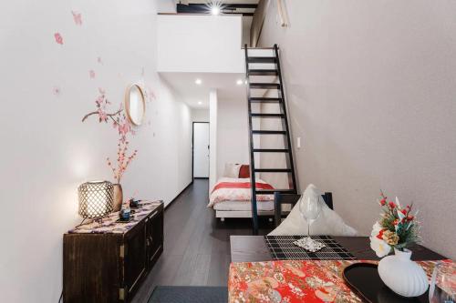 a living room with a staircase and a room with a couch at NEW-130m2 with 5toilets & 4 showers-Namba and USJ nearby in Osaka