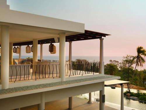 a house with a view of the ocean at Novus Jiva Anyer in Anyer