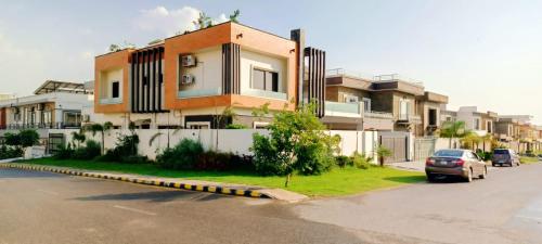 a car parked in front of a house at Haven Lodge, Islamabad in Islamabad