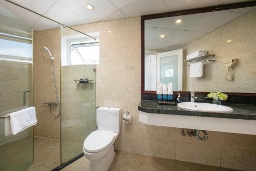 a bathroom with a toilet and a sink and a shower at Hanoi 20 Hotel & Apartment in Hanoi