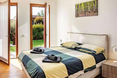 מיטה או מיטות בחדר ב-Appartamento Cansiglio