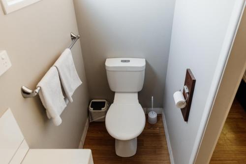 a small bathroom with a toilet and towels at BIG4 Breeze Holiday Parks - Katherine in Katherine