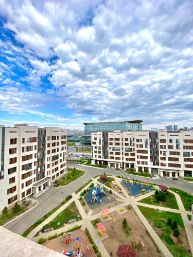 an aerial view of a courtyard in a city with buildings at Expo residence in Taldykolʼ