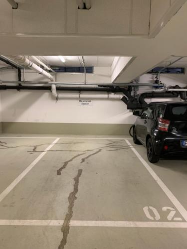 a parking lot with a car parked in a garage at Forchheim City-Zentral-Balkon in Forchheim