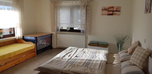 Ένα ή περισσότερα κρεβάτια σε δωμάτιο στο Ferienwohnung Sonnenschein