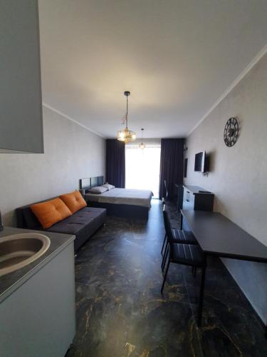 a large living room with a couch and a bed at Frozen View New Gudauri in Gudauri