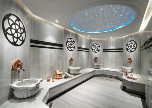 a bathroom with two tubs and two sinks at Nex Hotel & Spa Istanbul in Istanbul