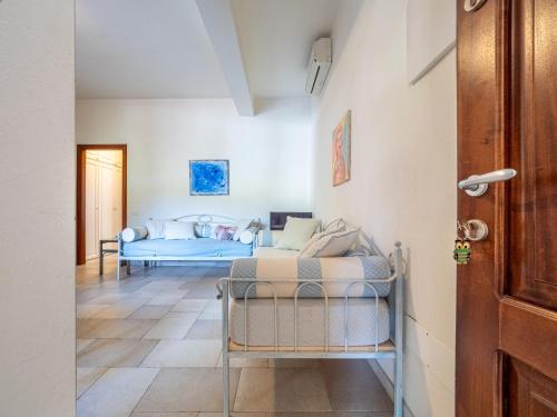a living room with a couch and a table at Ollastu Apartments Villasimius in Villasimius