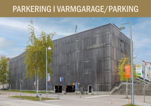 a large building with a sign on the side of it at Hotel Bishops Arms Piteå in Piteå