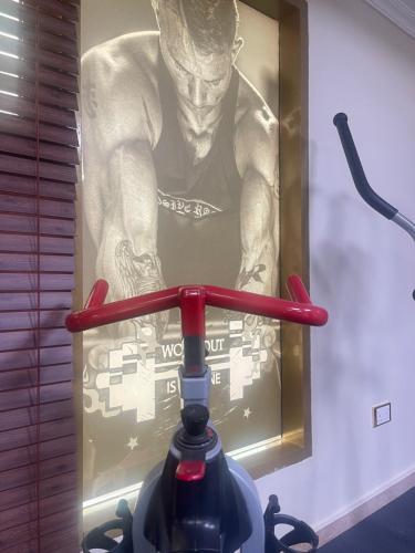 a framed picture of a man on a wall at AG Hotel in Abu Dhabi
