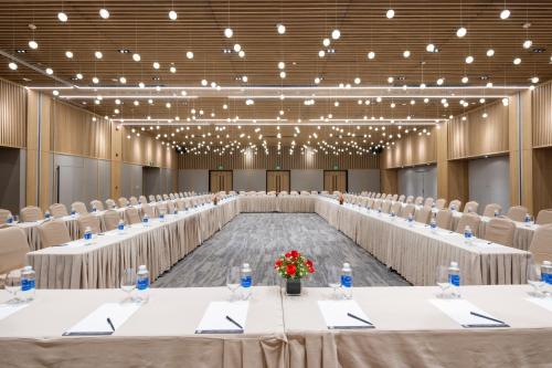a large conference room with tables and chairs at Anya Hotel Quy Nhon in Quy Nhon