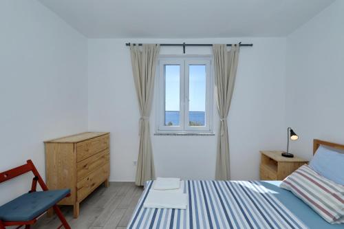 Postel nebo postele na pokoji v ubytování Horizonte apartman