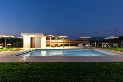 a swimming pool in front of a house at Incanto Toscano in Larciano