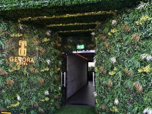 a building with a wall covered in plants at Gevora Hotel in Dubai