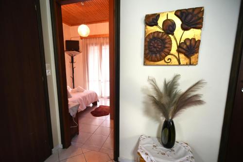 a hallway with a plant in a vase in a room at Casa Frasta in Tzoumerka in Frásta