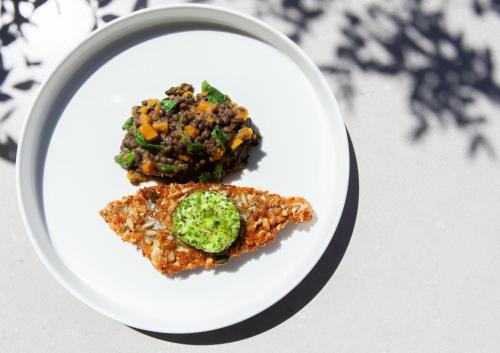 two pieces of food on a plate on a table at Deep Blu Boutique Hotel in Żurrieq