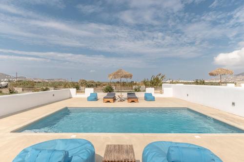 a swimming pool on the roof of a house at White Cocoon Exclusive villas in Naxos Chora