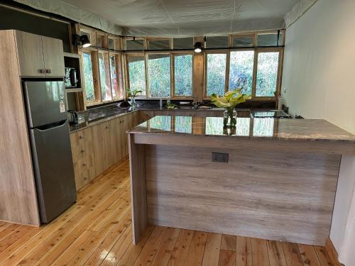 a kitchen with a large counter top in a room at Olesamara Collection in Nanyuki