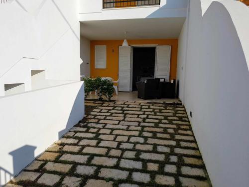 a view from the hallway of a house with a stone floor at Residence Boccaccio in Torre Pali 