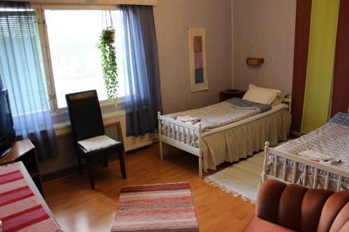 Postel nebo postele na pokoji v ubytování Motelli Nuttulinna