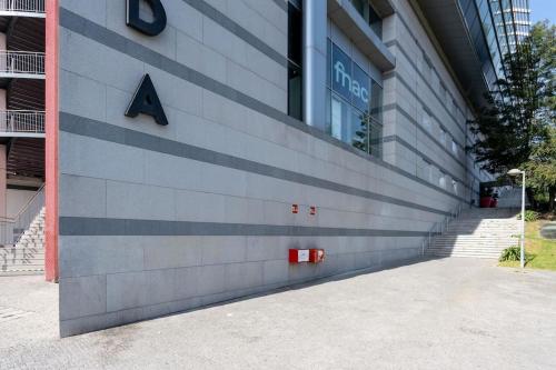 a building with a sign on the side of it at VIVA Stadium Residence Studios in Porto