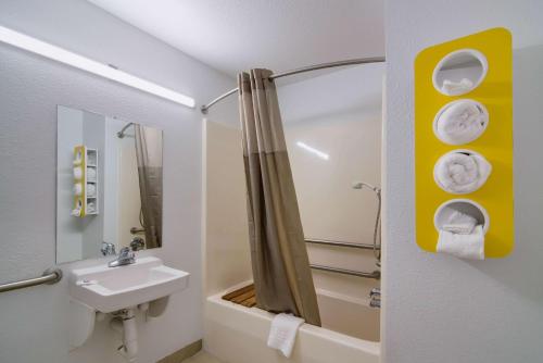 a bathroom with a sink and a toilet and a shower at Motel 6 Moss Point, MS in Moss Point