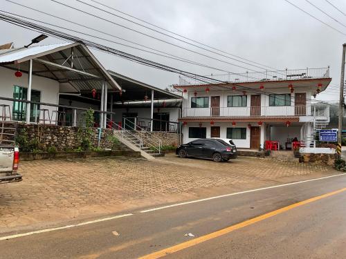 a black car parked in front of a building at Lake View @Rakthai in Ban Thung Kha Han