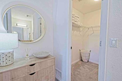 a bathroom with a sink and a mirror at Shamrock Park, Legacy Trail and Manasota Key! in Venice