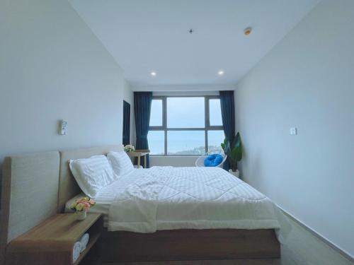 Ein Bett oder Betten in einem Zimmer der Unterkunft The sóng house vũng tàu Apartment