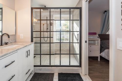 a kitchen with a glass door leading to a bedroom at Centrally Located Luxury House in Ann Arbor