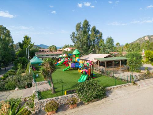 a park with a playground with a play equipment at 4 Mori Family Village - Villaggio per Famiglie in Muravera