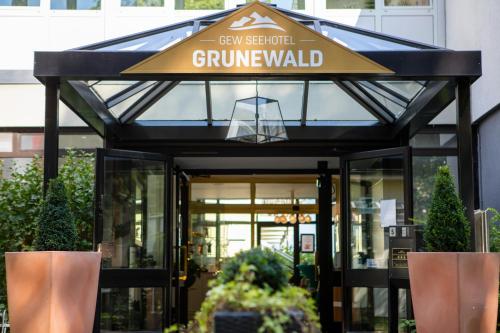 a building with a sign that reads gyn steel hotel grumpwald at Seehotel Grunewald in Berlin