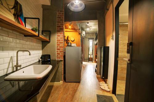 a bathroom with a sink and a refrigerator at Rent V38 #420 friendly Thailand in Bangkok